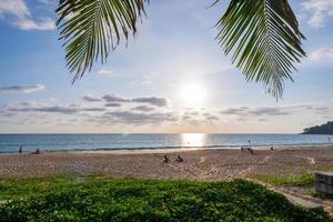 Beach summer vacations concept background Nature frame with coconut palm trees on the beach with sun light flare beautiful sunset or sunrise landscape background photo