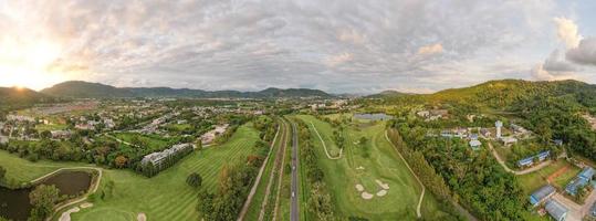 Aerial view panorama green golf field in Kathu district Phuket Thailand. Amazing landscape Drone camera High angle view photo