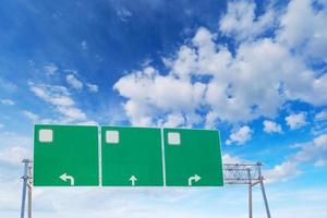 Blank green highway road sign on sky background.Empty road sign copy space photo