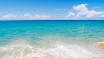 Aerial view of a blue sea surface water texture background and sun reflections Aerial flying drone view Waves water surface texture on sunny tropical ocean in Phuket island Thailand photo