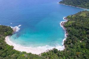 Aerial view Top down seashore wave crashing on seashore Beautiful turquoise sea surface in sunny day Good weather day summer background Amazing seascape top view photo