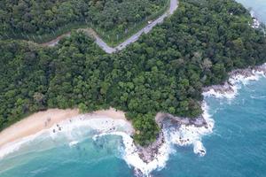 Aerial view Top down seashore wave crashing on seashore Beautiful turquoise sea surface in sunny day Good weather day summer background Amazing seascape top view photo