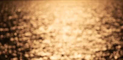 Beautiful gold abstract background with bokeh defocused lights,abstract background and design. photo