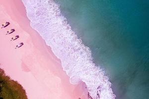 Top view of amazing pastel pink sand beach and turquoise sea copy space available nature background High angle view sea Summer background photo