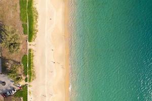 Phuket Thailand Aerial view sandy beach and waves Beautiful tropical sea in the morning summer season image by Aerial view drone shot, high angle view Top down beach photo