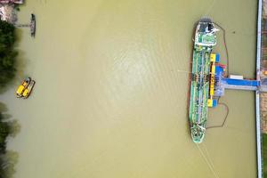 Aerial view of Harbor Cargo ship carrying container.Container ship Aerial view of business logistic import and export in the harbor photo