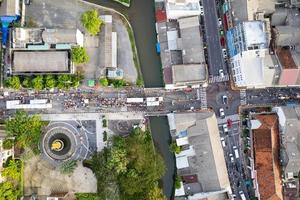 Aerial view Drone flying over phuket city Thailand.Drone over a street night market in Sunday at Phuket Town and Tourists walking shopping at old street full of local vendors selling Food and Clothes photo