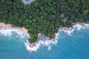 Aerial view Top down seashore wave crashing on seashore Beautiful turquoise sea surface in sunny day Good weather day summer background Amazing seascape top view photo