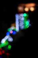 The bokeh lights on a dark background. photo