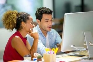 Multiracial business people working on new project marketing plan, meeting inside the modern office. photo