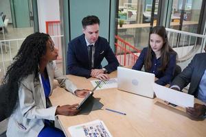 Business colleagues planning together in meeting photo