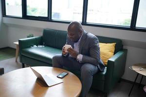 African American Entrepreneur and collaborating with coworkers over network internet 5G technology. photo