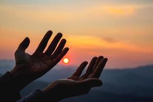 woman worship on sunset photo