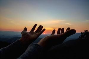 woman worship on sunset photo