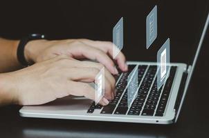 Man using laptop computer  document management and digital storage system screen virtual screen concept business. photo