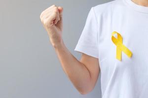 Suicide prevention day, Sarcoma, bone, bladder and Childhood cancer Awareness month, Yellow Ribbon for supporting people living and illness. children Healthcare and World cancer day concept photo