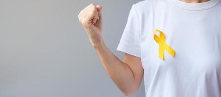 Suicide prevention day, Sarcoma, bone, bladder and Childhood cancer Awareness month, Yellow Ribbon for supporting people living and illness. children Healthcare and World cancer day concept photo