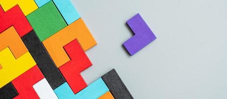 geometric shape block with colorful wood puzzle piece background. logical thinking, business logic, Conundrum, decision, solutions, rational, mission, success, goals and strategy concepts photo