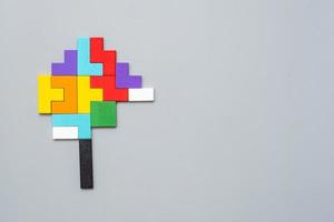 geometric shape block with colorful wood puzzle piece background. logical thinking, business logic, Conundrum, decision, solutions, rational, mission, success, goals and strategy concepts photo