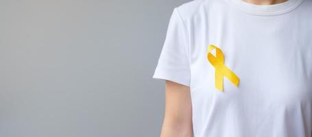 Suicide prevention day, Sarcoma, bone, bladder and Childhood cancer Awareness month, Yellow Ribbon for supporting people living and illness. children Healthcare and World cancer day concept photo