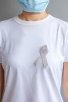 Brain Cancer Awareness month, grey color Ribbon for supporting people living. Healthcare and World cancer day concept photo