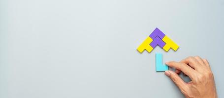 Umbrella shape block of colorful wood puzzle piece on gray background. logical thinking, business logic, Conundrum, decision, solutions, rational, mission, success, goals and strategy concepts photo