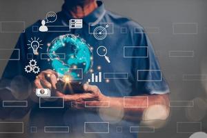 A businessman is using a smartphone to do online transactions with internet technology, a global data connection concept. with technology internet, big data, data search, online marketing photo