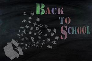 Top view banner message  Back to School  with color pencil Items for the school on  blackboard photo