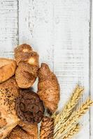 bakery on wood white background different types of bread photo