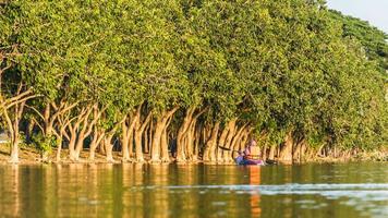 woman in kayak boat in the water photo