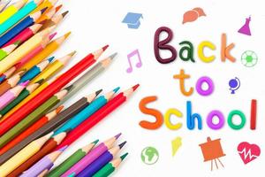 Top view banner message  Back to School  with color pencil Items for the school on white background photo