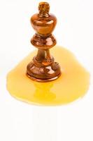 chess with honey on white background photo