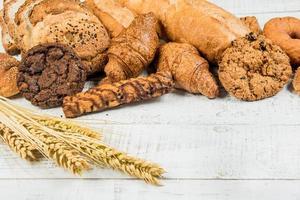 bakery on wood white background different types of bread photo