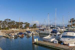 Marina view with moored yachts in the foreground, in the background Golden Gate Bridge in small, beautiful clouds, California, USA photo