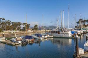 Marina view with moored yachts in the foreground, in the background Golden Gate Bridge in small, beautiful clouds, California, USA photo