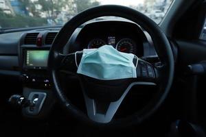 Face Mask in car on the console photo