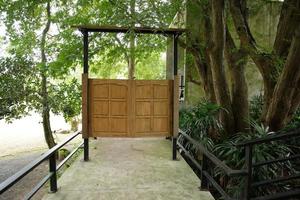 Wooden doors are in nature with walkways. photo