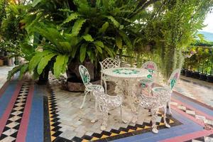 White iron garden table and chairs photo