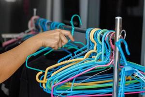 Clothes hangers preparing to dry clothes female hand