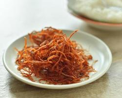 Crispy dried shredded pork on white background. photo