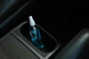 Spray alcohol in car protect covid 19 photo