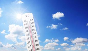 Thermometer with celsius scale showing extreme high temperature. photo