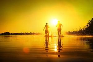 Group of friends having fun on the beach. photo