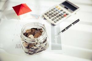 Money saving for house in the glass bottle photo