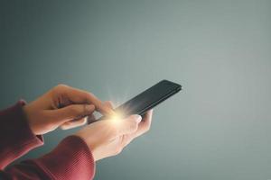 Woman using mobile smartphone for Internet connection, social media, online shopping, social networking, Point finger on screen mobile phone closeup. photo