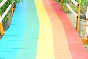 old wooden walkway painted in mordant colors. photo