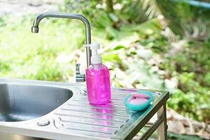 Soap and alcohol gel for hand washing photo