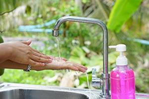 Human hands are washed with soap and Alcohol gel to prevent virus photo