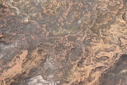 stone background was eroded by the wind creating a beautiful pattern. marble background with text photo