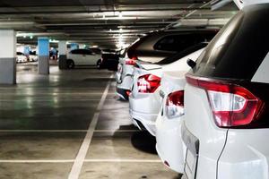 cars in parking garage interior photo